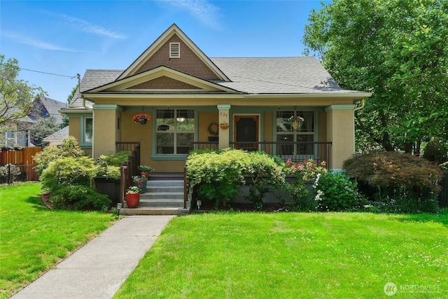634 University St, Walla Walla, WA 99362 - view of front facade with a porch, stucco siding, and roof with shingles