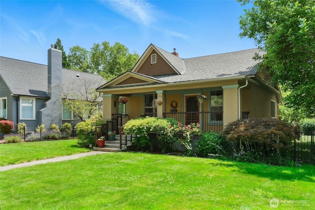 634 University St, Walla Walla, WA 99362 - view of front of property with a porch, stucco siding, and roof with shingles