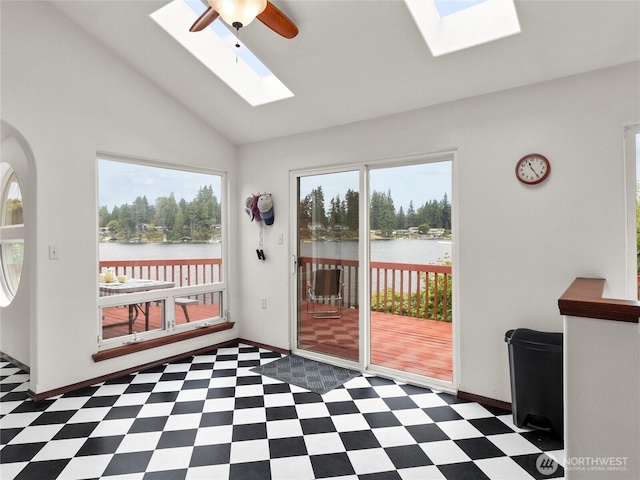 2519 Carpenter Rd, Lacey, WA 98503 - doorway to outside featuring a skylight, tile patterned floors, a water view, and lofted ceiling