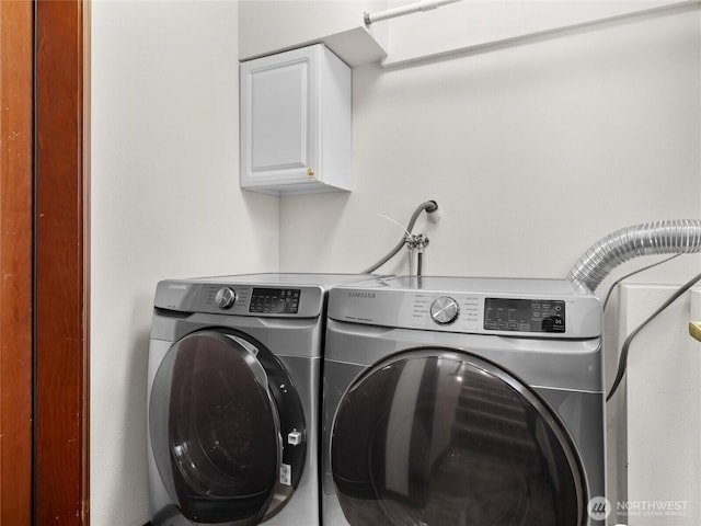 2519 Carpenter Rd, Lacey, WA 98503 - laundry area with cabinet space and washing machine and clothes dryer