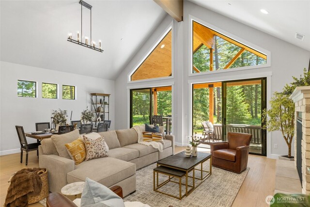 81 Plateau Loop, Cle Elum, WA 98922 - living area featuring plenty of natural light, high vaulted ceiling, wood finished floors, and recessed lighting