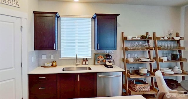 5845 Waverly Rd SW, Port Orchard, WA 98367 - kitchen with stainless steel dishwasher, light countertops, and backsplash