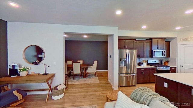 5845 Waverly Rd SW, Port Orchard, WA 98367 - kitchen featuring stainless steel appliances, light countertops, light wood-style flooring, recessed lighting, and dark brown cabinetry