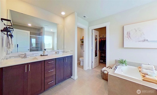 5845 Waverly Rd SW, Port Orchard, WA 98367 - bathroom featuring a stall shower, a bath, tile patterned flooring, double vanity, and a walk in closet