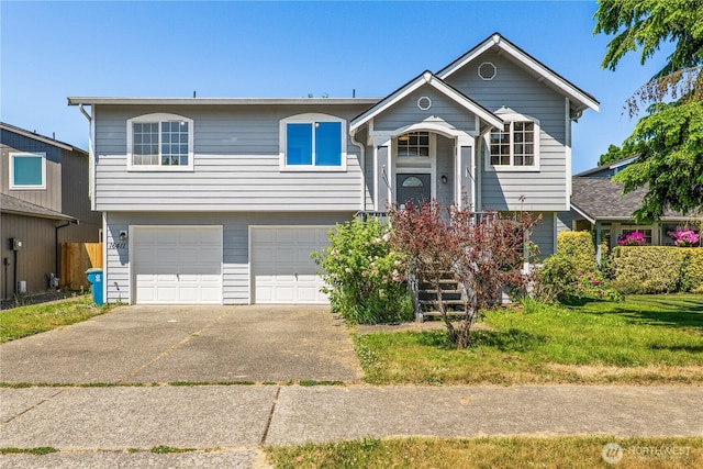 16411 156th St SE, Monroe, WA 98272 - raised ranch featuring a garage and concrete driveway