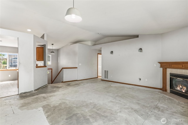 16411 156th St SE, Monroe, WA 98272 - unfurnished living room featuring unfinished concrete flooring, vaulted ceiling, and a fireplace