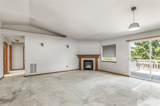 16411 156th St SE, Monroe, WA 98272 - unfurnished living room featuring a fireplace, lofted ceiling, and concrete flooring