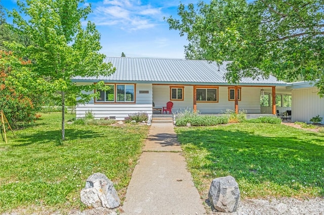 14985 Chumstick, Leavenworth, WA 98826 - view of front of house with a porch, a front lawn, and a metal roof