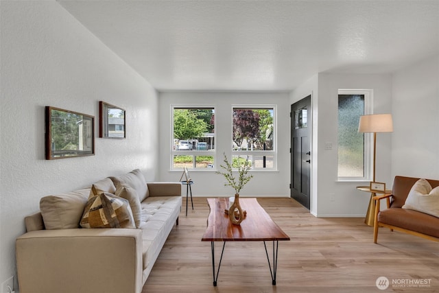 7040 SE Truman St, Port Orchard, WA 98366 - living area with light wood-style floors and baseboards
