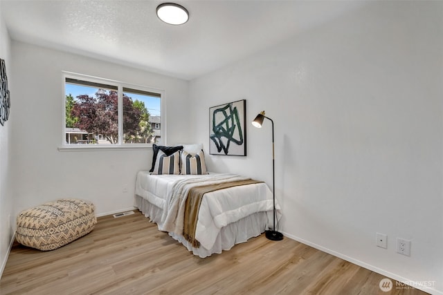 7040 SE Truman St, Port Orchard, WA 98366 - bedroom featuring light wood finished floors and baseboards