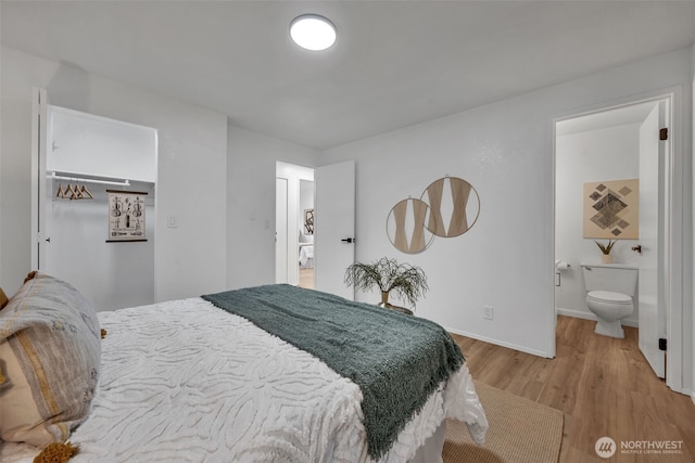 7040 SE Truman St, Port Orchard, WA 98366 - bedroom featuring light wood-type flooring and ensuite bath