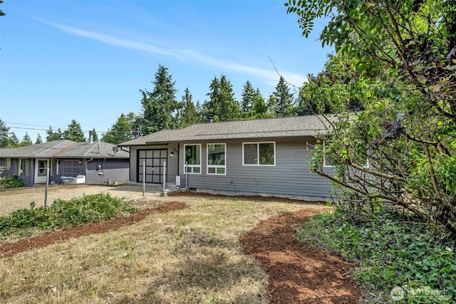 7040 SE Truman St, Port Orchard, WA 98366 - ranch-style house with a garage and driveway