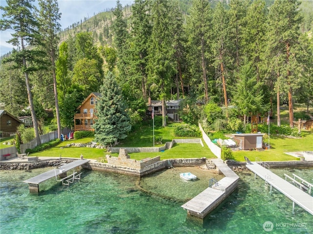 9368 S Lakeshore Rd, Chelan, WA 98816 - dock area with a yard, a view of trees, and a water view