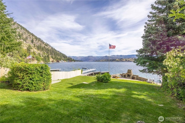 9368 S Lakeshore Rd, Chelan, WA 98816 - view of green lawn featuring a water and mountain view and a dock