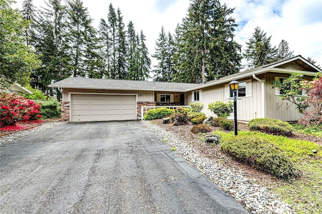 141 Leslie Ln, Sequim, WA 98382 - ranch-style home with asphalt driveway and a garage