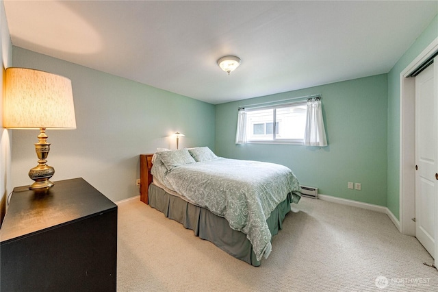 141 Leslie Ln, Sequim, WA 98382 - carpeted bedroom featuring a baseboard heating unit and a closet
