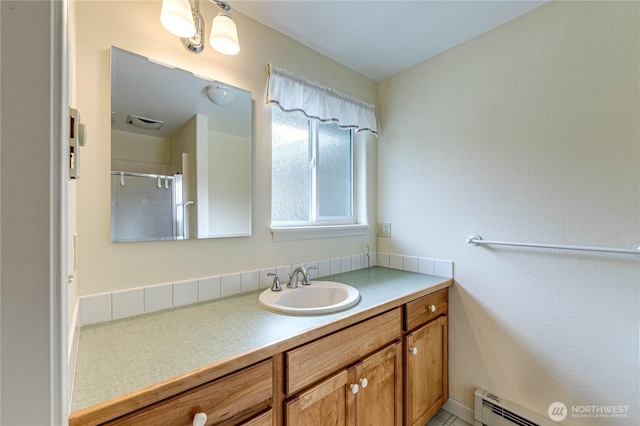141 Leslie Ln, Sequim, WA 98382 - bathroom featuring vanity, a baseboard radiator, and a shower