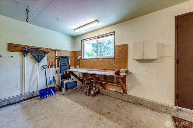 141 Leslie Ln, Sequim, WA 98382 - miscellaneous room with a workshop area and unfinished concrete flooring