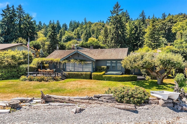 14504 Glen Acres Rd, Vashon, WA 98070 - view of front of property with a front lawn, a deck, and a view of trees