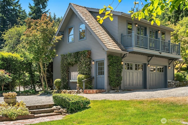 14504 Glen Acres Rd, Vashon, WA 98070 - view of front facade featuring a balcony, a garage, and driveway