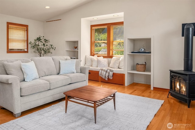 14504 Glen Acres Rd, Vashon, WA 98070 - living room featuring a wood stove, lofted ceiling, light wood-style floors, and recessed lighting