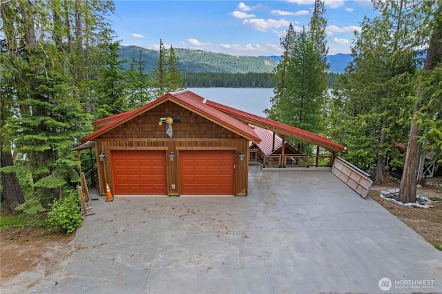 15320 Cedar Brae, Leavenworth, WA 98826 - garage with a wooded view, a mountain view, and driveway