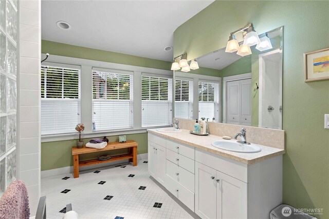 15320 Cedar Brae, Leavenworth, WA 98826 - bathroom featuring double vanity, tile patterned floors, and lofted ceiling