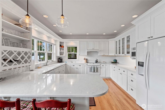 15320 Cedar Brae, Leavenworth, WA 98826 - kitchen featuring white appliances, open shelves, a peninsula, tasteful backsplash, and light wood-style flooring