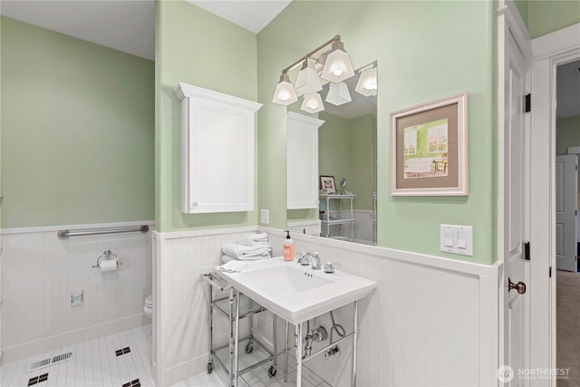 15320 Cedar Brae, Leavenworth, WA 98826 - bathroom with wainscoting and tile patterned floors