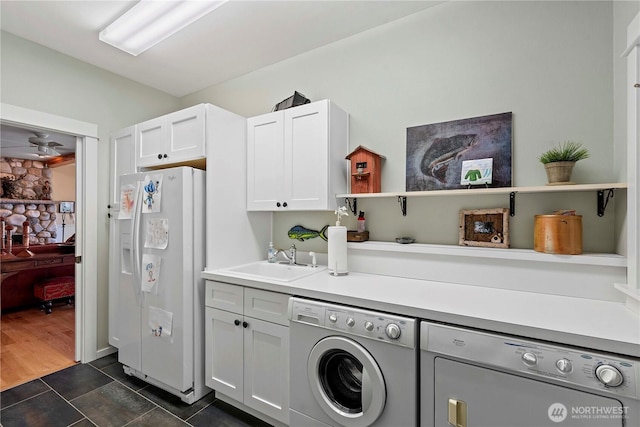 15320 Cedar Brae, Leavenworth, WA 98826 - laundry area with separate washer and dryer, cabinet space, and dark tile patterned flooring