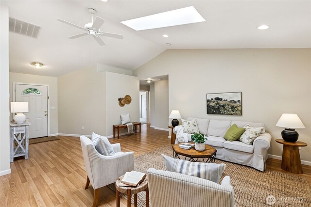 8537 Thuja Ave SE, Yelm, WA 98597 - living room featuring a ceiling fan, vaulted ceiling, light wood finished floors, a skylight, and recessed lighting