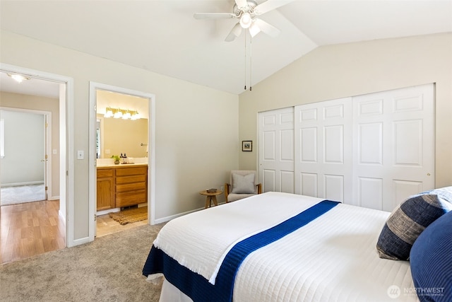 8537 Thuja Ave SE, Yelm, WA 98597 - bedroom featuring light carpet, vaulted ceiling, a closet, connected bathroom, and a ceiling fan