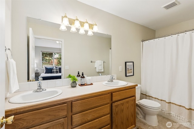 8537 Thuja Ave SE, Yelm, WA 98597 - full bath featuring double vanity, connected bathroom, tile patterned floors, and a shower with shower curtain