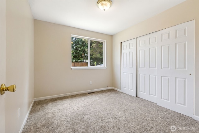8537 Thuja Ave SE, Yelm, WA 98597 - unfurnished bedroom featuring carpet and a closet