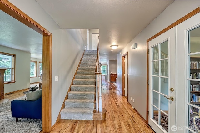 5679 W 31st Crst, Ferndale, WA 98248 - stairway with wood finished floors and healthy amount of natural light
