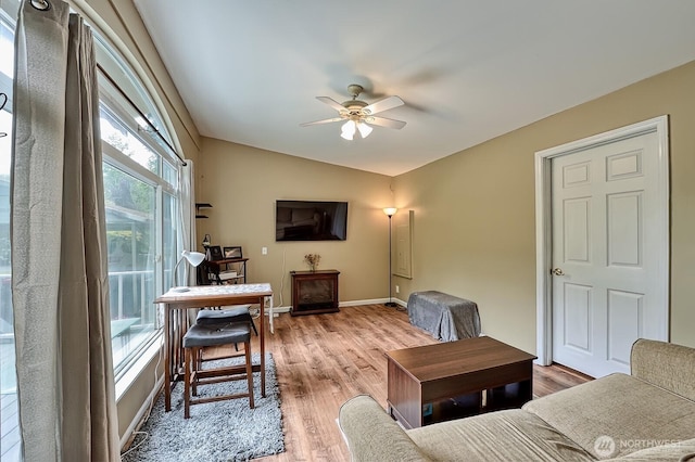 5679 W 31st Crst, Ferndale, WA 98248 - living room featuring a ceiling fan, lofted ceiling, and light wood-style flooring