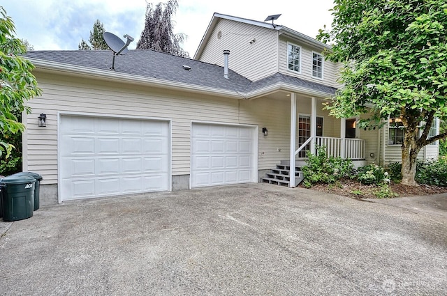 5679 W 31st Crst, Ferndale, WA 98248 - view of front of home featuring driveway, a garage, a porch, and roof with shingles