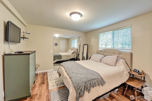 5679 W 31st Crst, Ferndale, WA 98248 - bedroom featuring light wood-style flooring and baseboards