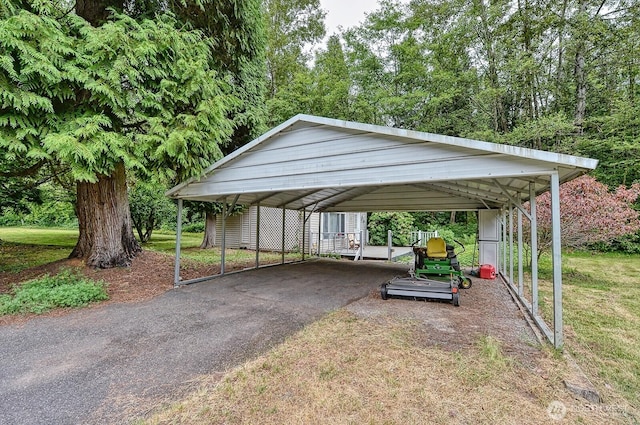 5679 W 31st Crst, Ferndale, WA 98248 - view of vehicle parking with driveway and a detached carport