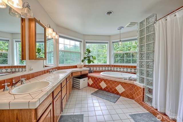 5679 W 31st Crst, Ferndale, WA 98248 - bathroom with a garden tub, double vanity, and tile patterned floors