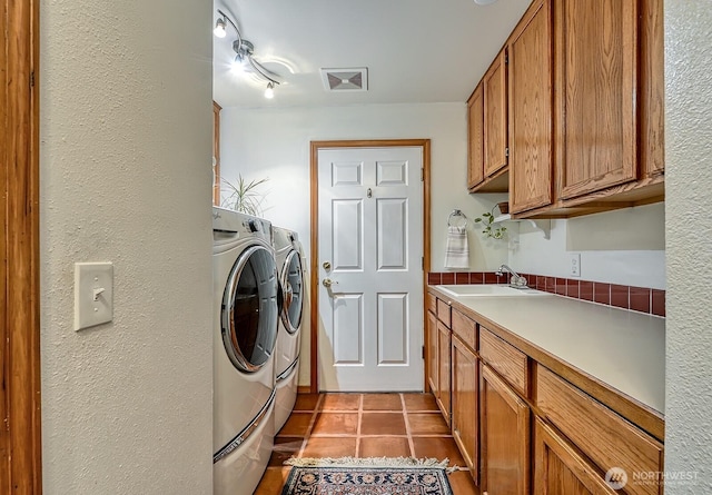 5679 W 31st Crst, Ferndale, WA 98248 - washroom featuring independent washer and dryer, tile patterned floors, and a textured wall