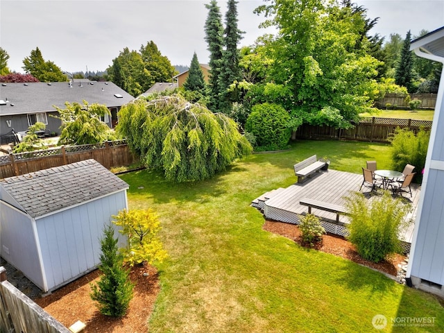 3401 F Ave, Anacortes, WA 98221 - fenced backyard with a wooden deck and a storage shed