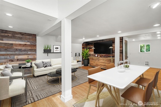 10746 Densmore Ave N, Seattle, WA 98133 - dining space featuring wood walls, light wood finished floors, recessed lighting, and an accent wall