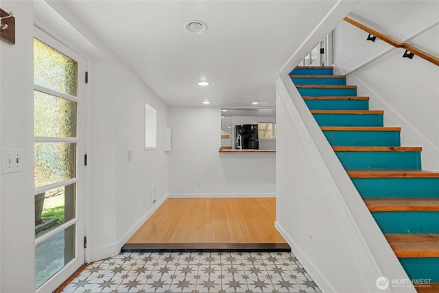 10746 Densmore Ave N, Seattle, WA 98133 - staircase with tile patterned floors, plenty of natural light, and recessed lighting