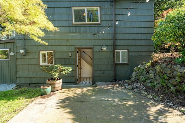 10746 Densmore Ave N, Seattle, WA 98133 - doorway to property with a patio area