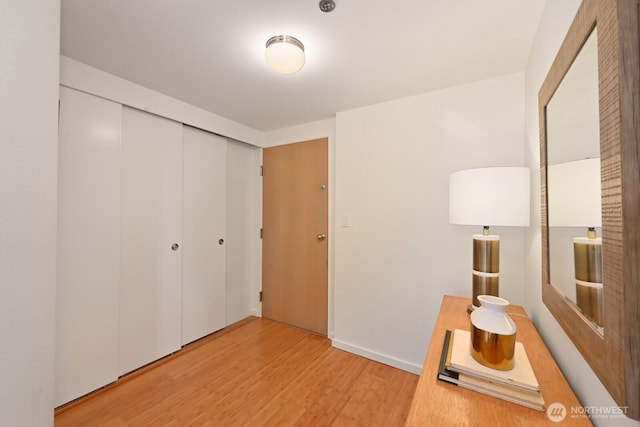 121 Vine St Unit 703, Seattle, WA 98121 - unfurnished bedroom with light wood-style floors and a closet
