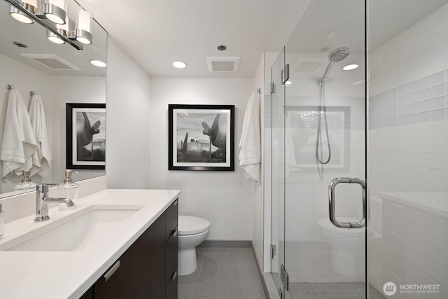 121 Vine St Unit 703, Seattle, WA 98121 - full bath featuring vanity, a shower stall, tile patterned floors, and recessed lighting