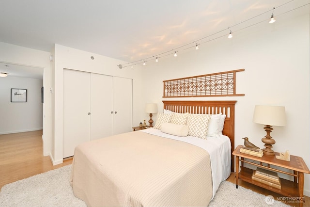 121 Vine St Unit 703, Seattle, WA 98121 - bedroom featuring a closet and light wood-style flooring