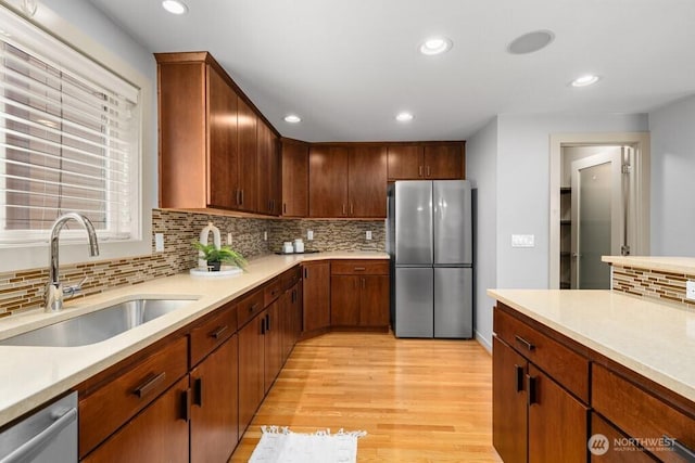 7747 Sand Point Way NE Unit A, Seattle, WA 98115 - kitchen with appliances with stainless steel finishes, light countertops, light wood-type flooring, decorative backsplash, and recessed lighting