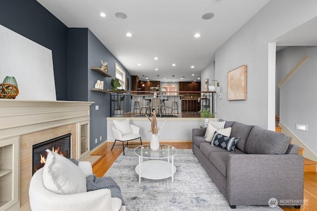 7747 Sand Point Way NE Unit A, Seattle, WA 98115 - living area featuring wood finished floors, recessed lighting, and a fireplace